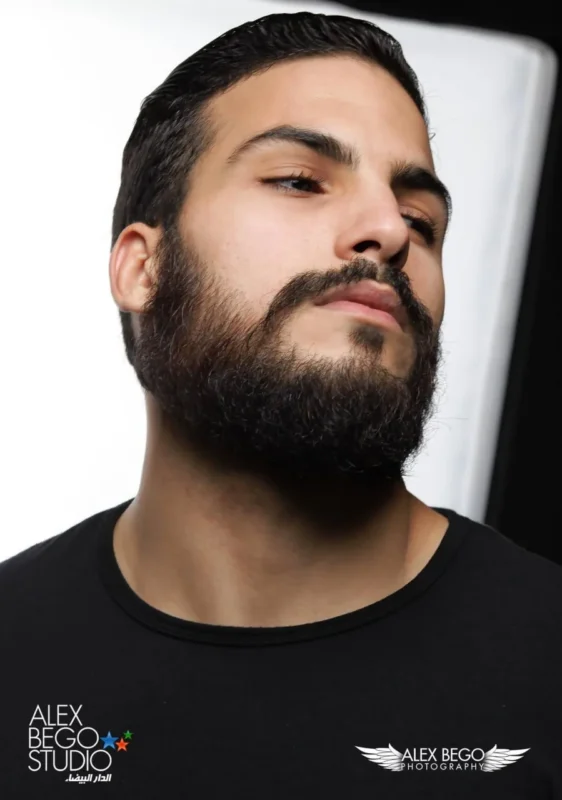 Your First Photoshoot in Casablanca: What to Bring and What to Expect 4 High-key studio portrait of a bearded man on a white background, by Alex Bego